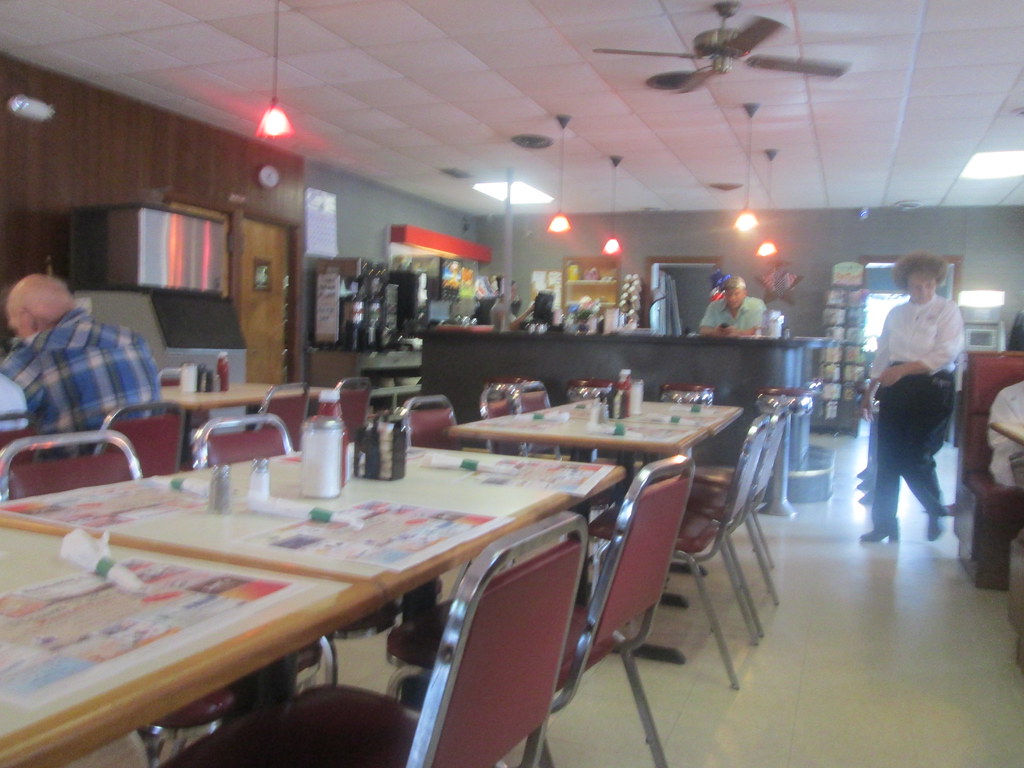 Casual restaurant dining room with tables and ambient lighting